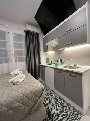 a hotel room with a bed and a sink at Medusa suite stadiou by Zeussuites in Athens