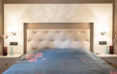 a bedroom with a large bed with flowers on it at Designers apartment in Galatsi area in Athens