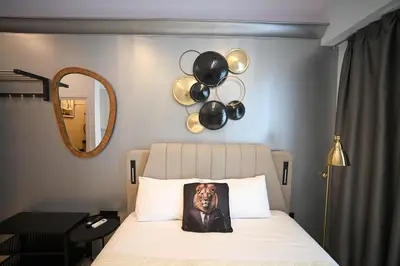 a bedroom with a bed with a picture of a dog on a pillow at Acropolis View Suite Klathmonos by Zeussuites in Athens