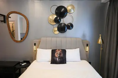 a bed with a picture of a dog on a pillow at Acropolis View Suite Klathmonos by Zeussuites in Athens