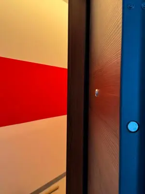 a close up of a door with a colorful wall at Acropolis Urban Suite Klathmonos by Zeus Suites in Athens