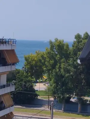 a view of the ocean from a building at Spacious seaside flat at alimos in Athens
