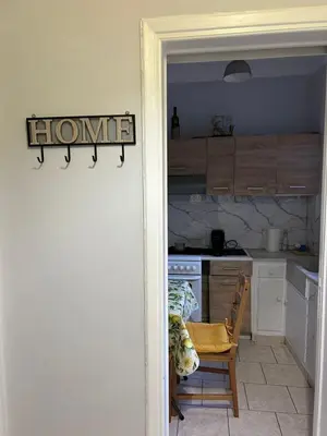 a kitchen with a sign that reads homework on the wall at Atelier Ioulianou 72 in Athens
