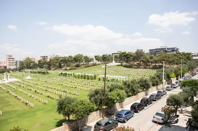 a view of a park with cars parked at Spacious and sunlit seaside flat in Athens
