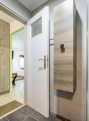 a pivot door in a room with a door at Comfort Kolonaki Stay - Piano & Art in Athens