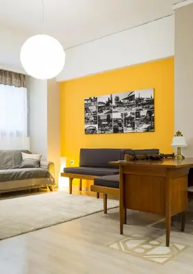 a living room with a couch and a table at Comfort Kolonaki Stay - Piano & Art in Athens