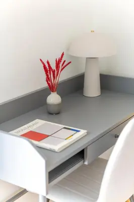 a white desk with two chairs and a vase at Adorable 2BR Apartment in Neos Kosmos by UPSTREET in Athens