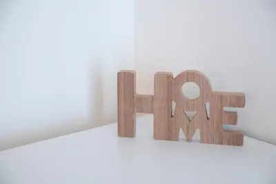 a wooden sign that says help on a shelf at Niki Athens Suites - Sunny Suite at Historical Centre Monastiraki in Athens