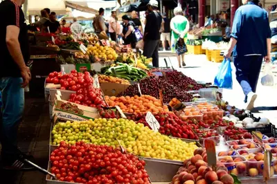 a market filled with lots of different fruits and vegetables at Niki Athens Suites - Sunny Suite at Historical Centre Monastiraki in Athens