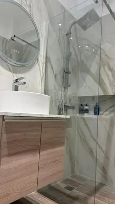 a bathroom with a sink and a mirror at Angel Home in Athens