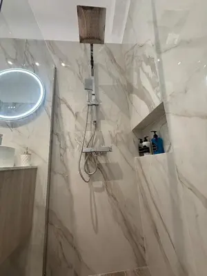a bathroom with a shower and a sink at Angel Home in Athens