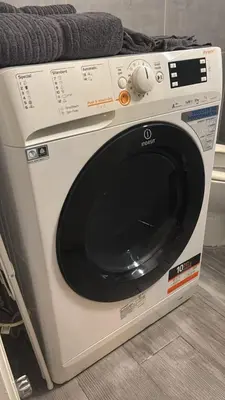 a white washing machine sitting on a shelf at Hidden Gem in the Heart of City in Athens