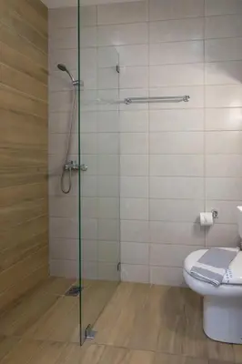 a bathroom with a glass shower with a toilet at Heaven apartment in the heart of Athens in Athens
