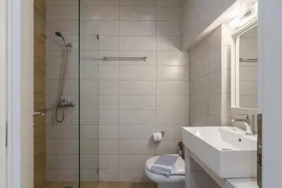 a bathroom with a shower and a toilet and a sink at Heaven apartment in the heart of Athens in Athens