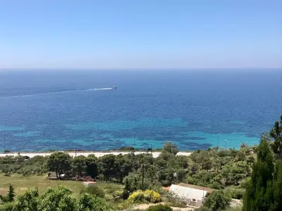 a view of the ocean with a boat in the water at Casa Arsida in Anavissos