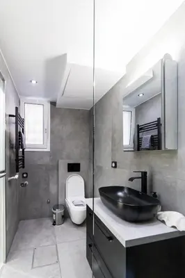 a bathroom with a sink and a toilet at Athenian Kolonaki Apartment in Athens