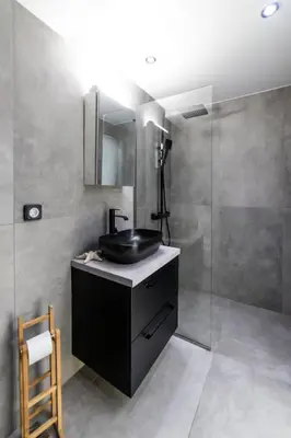 a bathroom with a black sink and a shower at Athenian Kolonaki Apartment in Athens