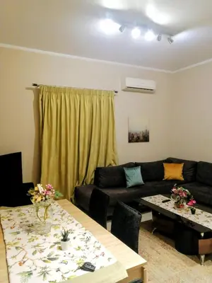a living room with a couch and a table at Raffaella Athens in Athens