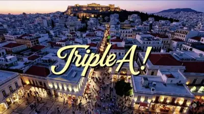 a view of a city at night with the text title at Triple A - Psiri Urban Charm Studios at Theatrou Square I Free Parking in Athens