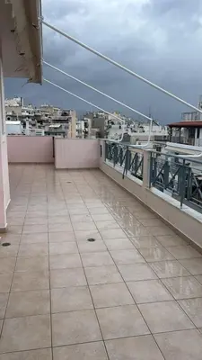 a balcony of a building with a view of a city at Spacious & Modern seaside house in Piraeus