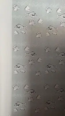 a wall with drawings of fish on it at Spacious & Modern seaside house in Piraeus