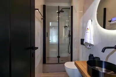 a bathroom with a shower and a sink at Triple A - Psiri Urban Magic Studios at Theatrou Square III Free Parking in Athens