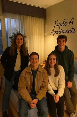 a group of people posing for a picture in a room at Triple A - Psiri Urban Magic Studios at Theatrou Square III Free Parking in Athens
