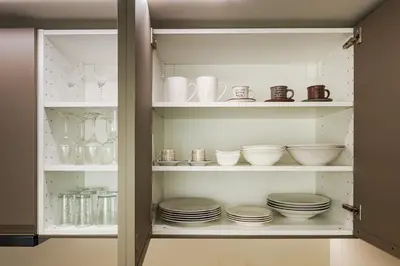 a cabinet filled with plates and bowls and dishes at The Athenian Aroma - Suite with Jacuzzi in Athens