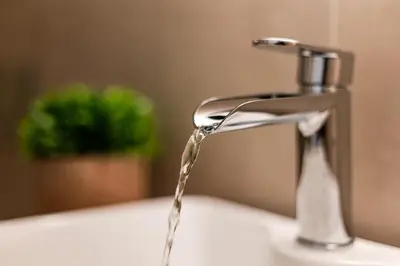 a sink with water coming out of a faucet at The Athenian Aroma - Suite with Jacuzzi in Athens