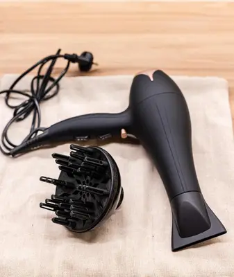 a hair dryer sitting on top of a table at The Athenian Aroma - Suite with Jacuzzi in Athens