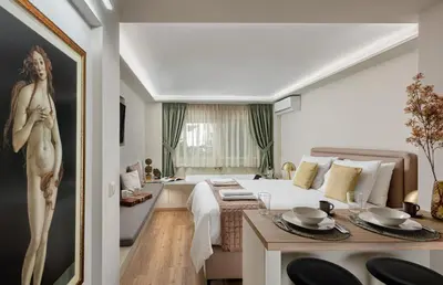 a hotel room with a bed and a bathroom at The Athenian Aroma - Suite with Jacuzzi in Athens