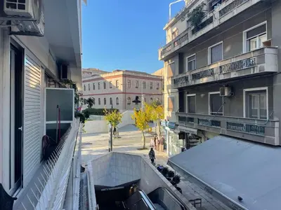 a view of a street from a balcony of a building at Xenia's Elegant Acropolis Suite in Athens