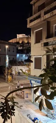 a view of a building at night at Xenia's Elegant Acropolis Suite in Athens