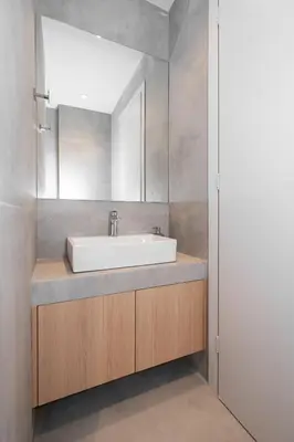 a bathroom with a sink and a mirror at Spacious & Stylish Athens Apartment - Walk to Metro in Athens