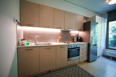 a kitchen with a sink and a stove at Tsakalof Penthouse by Zeus Suites in Athens
