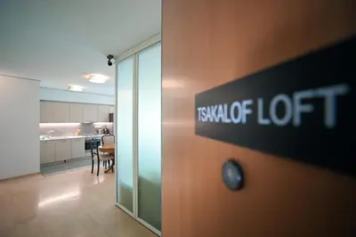 an office with a sign on the door of a room at Tsakalof Penthouse by Zeus Suites in Athens