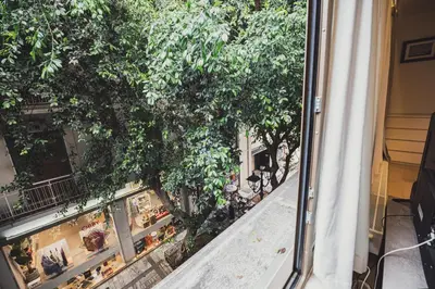 a view from a window of a street with trees at Tsakalof 10A in Athens