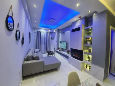 a living room with a couch and a fireplace at Apartament Fbi in Athens