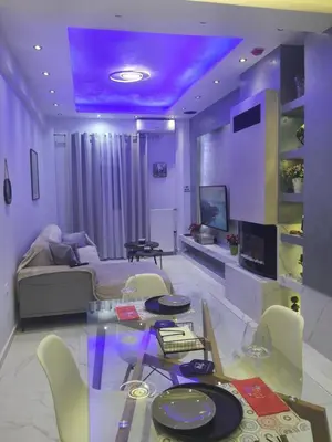 a living room with a glass table and a couch at Apartament Fbi in Athens