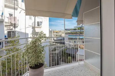 a balcony with a potted plant in a pot at Brand New Luxury Apt Below Acropolis in Athens