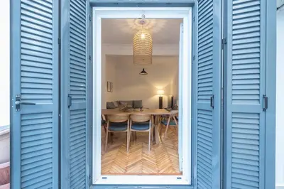 a window into a dining room with a table at Zen Melody, Neapoli in Athens