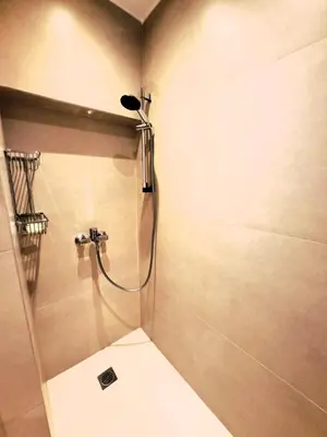 a bathroom with a shower with a toilet at TrilogyCentral in Athens