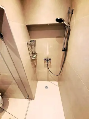 a shower with a shower head in a bathroom at TrilogyCentral in Athens