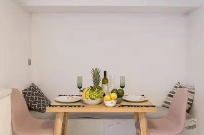 a table with a bowl of fruit on it at Zeus1 beach front appatment, 1BR sea view in Athens