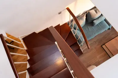 a wooden staircase with wooden treads and wood floors at Zeus2 Beach Front Apartment, 3BR in Athens