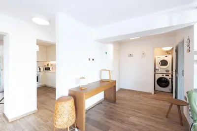 a living room with a desk and a microwave at Zeus2 Beach Front Apartment, 3BR in Athens