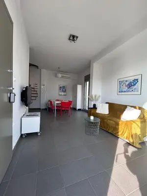 a living room with a bed and a table at The Best View !!! in Athens