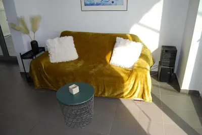 a living room with a couch and a table at The Best View !!! in Athens