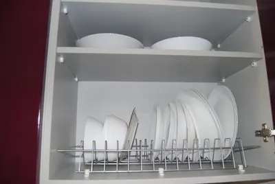 a shelf filled with white plates and bowls at The Best View !!! in Athens