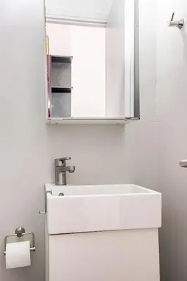 a bathroom with a white sink and a mirror at The Best View !!! in Athens